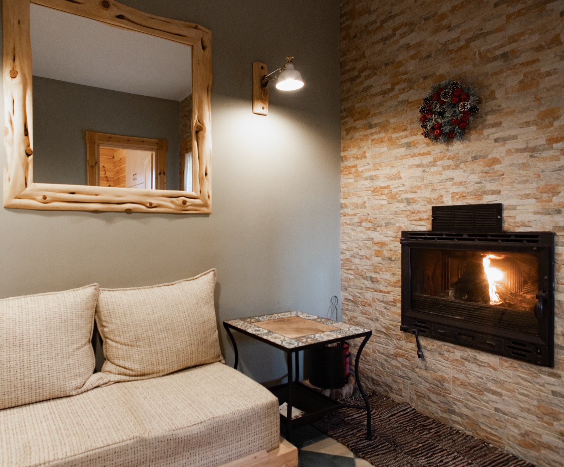 Sitting corner beside the stone fireplace